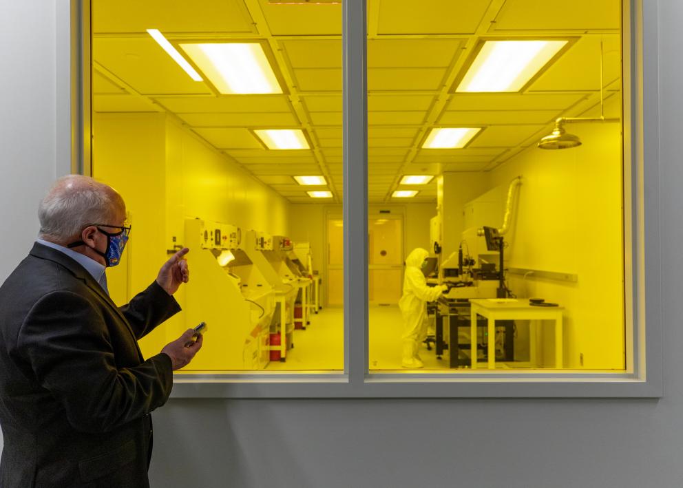 man looking into window of KU Nanofabrication Facility