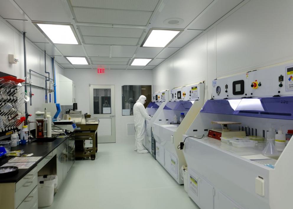 researcher using fabrication equipment in KU Nanofabrication Facility