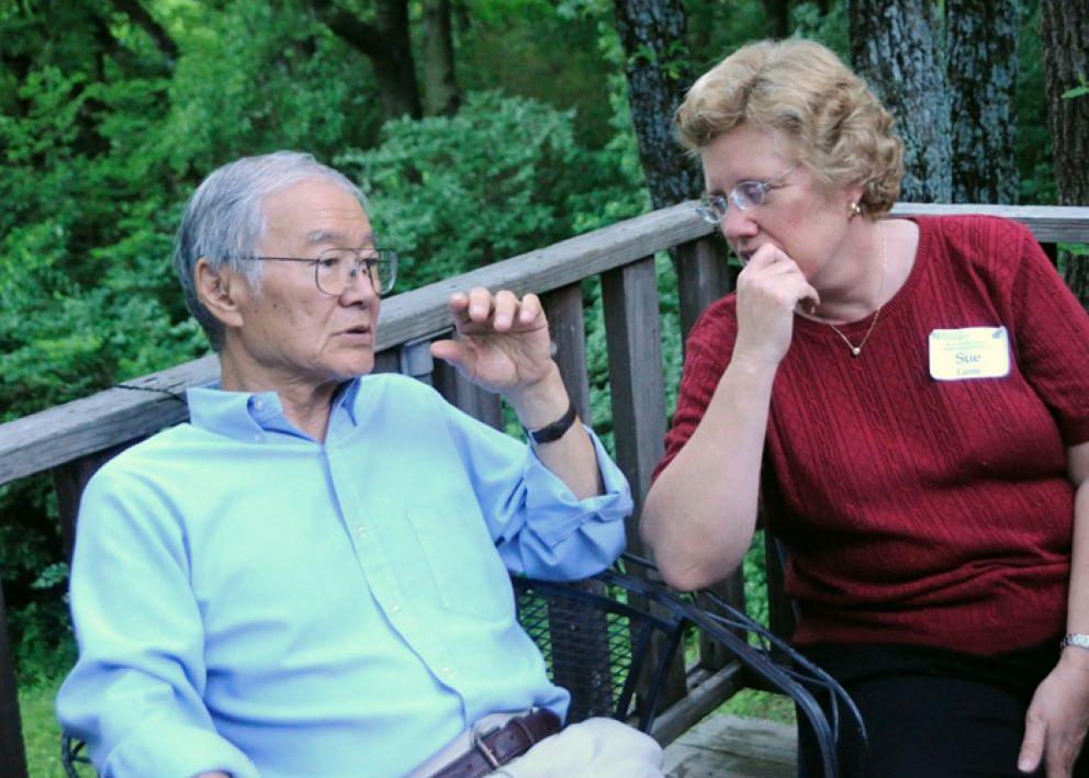 Ted Kuwana and Sue Lunte talking on outside deck