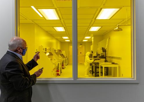 man looking into window of KU Nanofabrication Facility